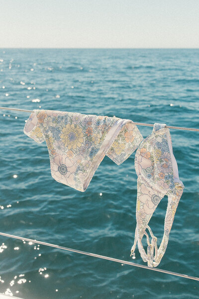 Luxury white lingerie floating in water, lifestyle branding imagery for social media