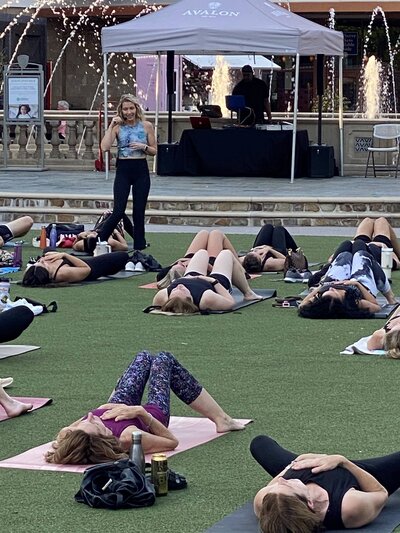 Stephanie leading community yoga class 