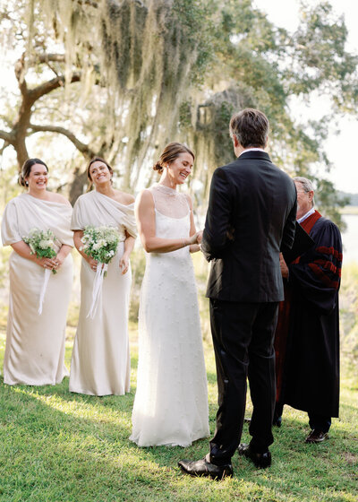 Bride Smiling during wedding ceremony photo