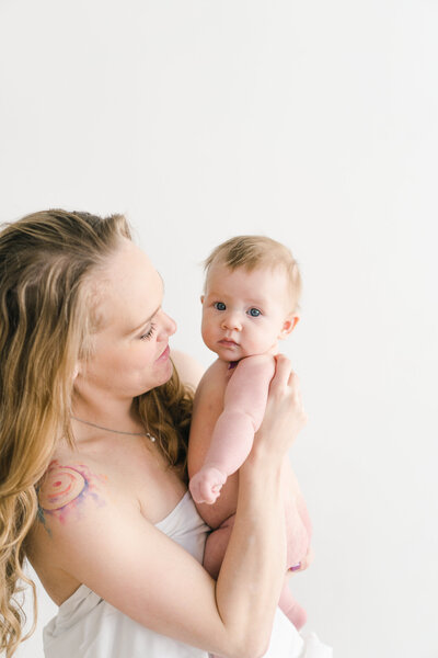asheville studio mom holding naked baby