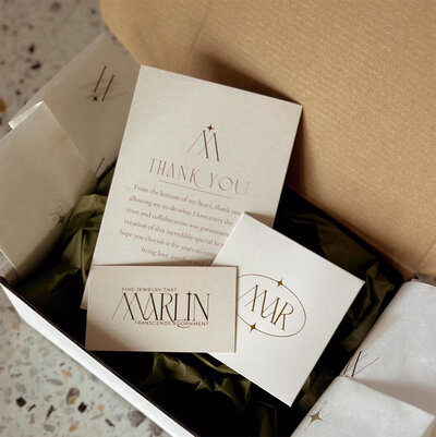 Open box with packaging materials in clients branding