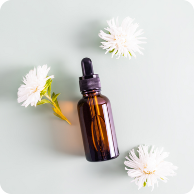An amber bottle containing custom-blended aromatherapy oils, crafted to promote wellness and balance with natural, therapeutic scents.