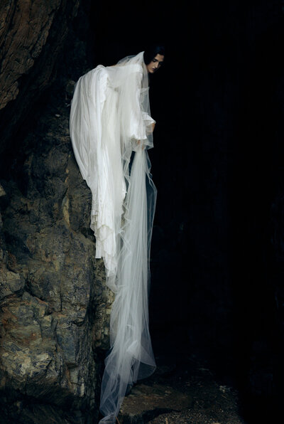 Silk fabric used for bridal gown left on wall in darkness
