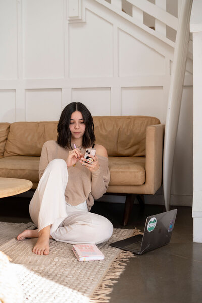 girl sitting down during photoshoot for business