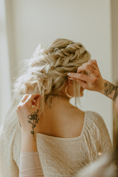 Bride having her hair touched up