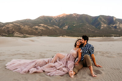 Engagement photo session in the sand by traveling photographers Sweet Justice in the Sand Dunes in Colorado.