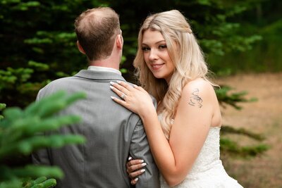 bride and groom in the woods