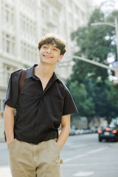 Senior pictures of a teen boy in Los Angeles with editorial fashion styling and city backdrop.

