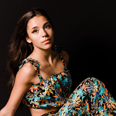 Studio photo of Montana model in floral jumpsuit, Kalispell