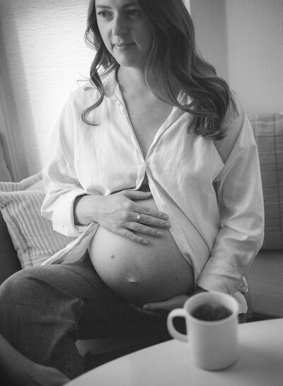 Black and white photo of pregnant mom at home