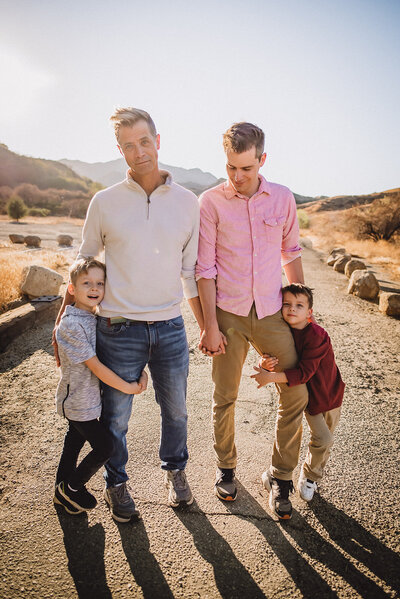 Gay couple with twin boys on Los Angeles trail