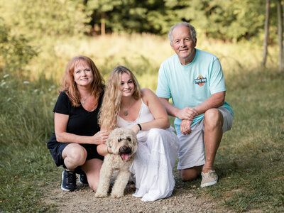 senior girl with parents and dog for portraits at westcreek reservation