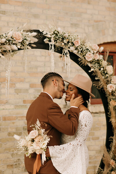 Bride and Groom share their first kiss as husband and wife at the cooperage in milwaukee