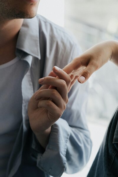 Man and woman holding hands