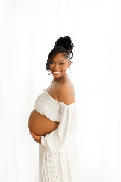 pregnant woman posing taken by boston maternity photographer