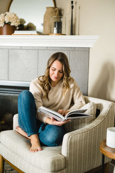 woman reading a design book