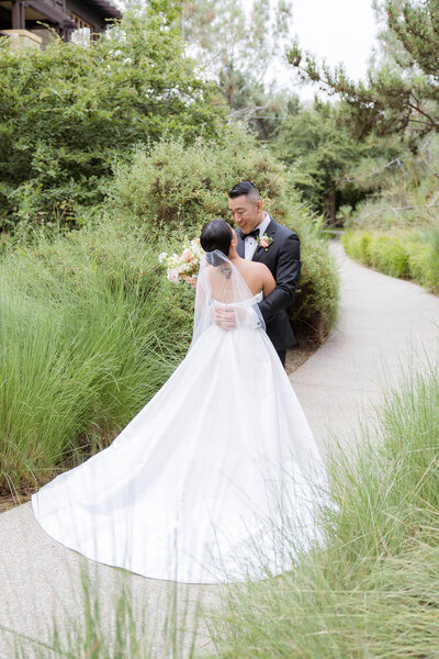 Bride and groom walk up memorial steps at their DC wedding