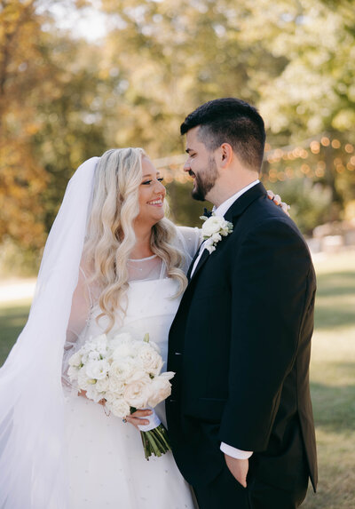 Bride and Groom taking pre ceremony pictures at Danclay Farms