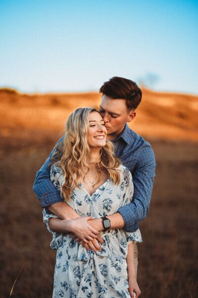 Couples embracing each other for engagement photos