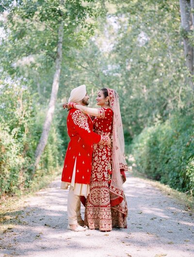 Indian bride an d groom huggin
