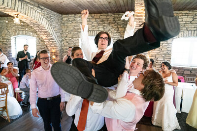 Groomsmen dance at reception.