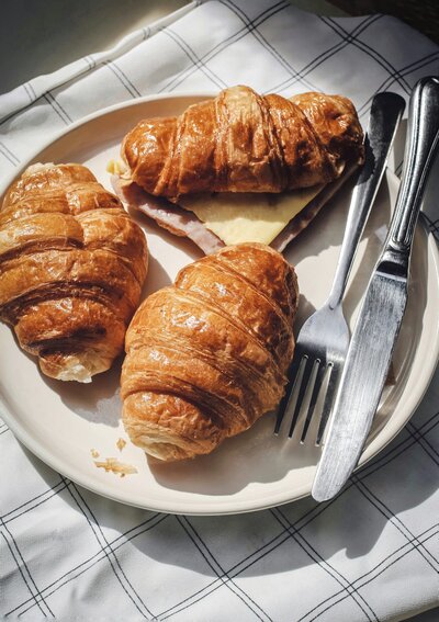 Croissants on a plate with silverware
