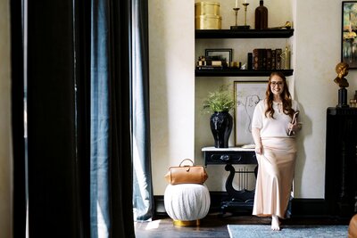 monica standing by bookshelf