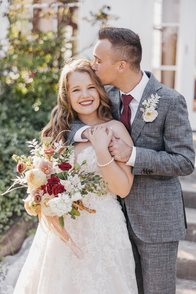 bride and groom kissing