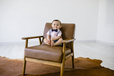 baby boy sitting in chair