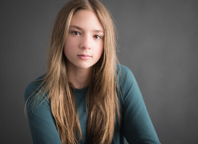 teen in teal shirt in beautiful portrait for performing arts