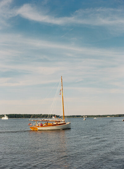 A sailboat on the water just outside of Chesapeake Bay Maritime Museum during a wedding