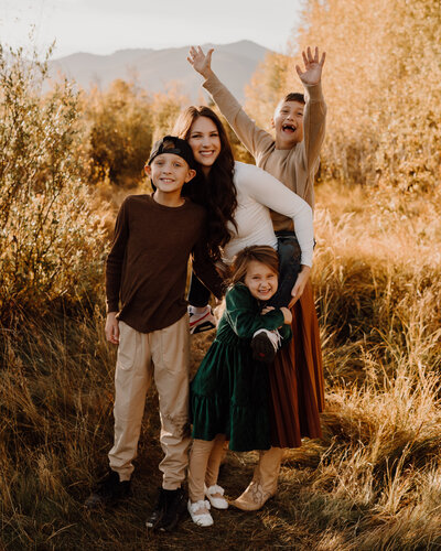 Happy family smiling outdoors