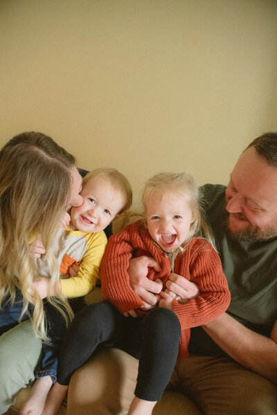 family maternity photoshoot in michigan in a field