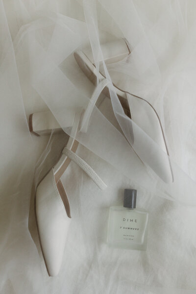 White Wedding Heels and Clear Dime Perfume Bottle