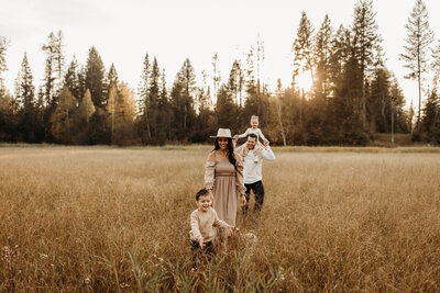 Brogans family in montana fields in front of big trees