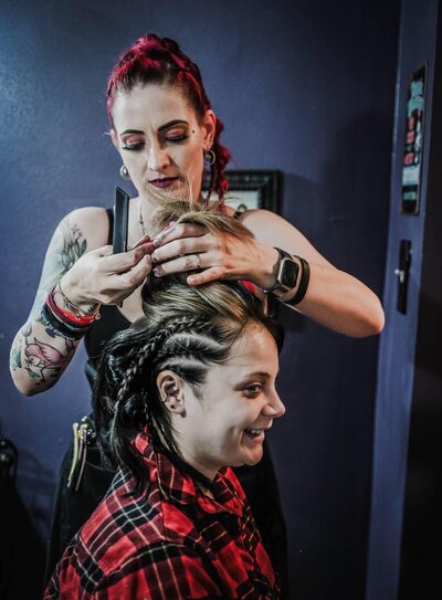 Jill from Your Girl Friday LV styles a non-traditional bride’s braided updo in Texas for her Renaissance faire-themed wedding.
