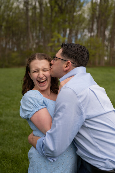 maryland couple laughing and kissing.