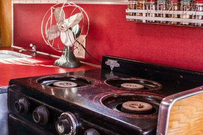 Destination marketing photo stove top interior mini air stream trailer Gatos Trail Ranch