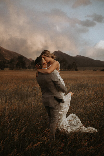 couple kissing during glacier national park wedding day 