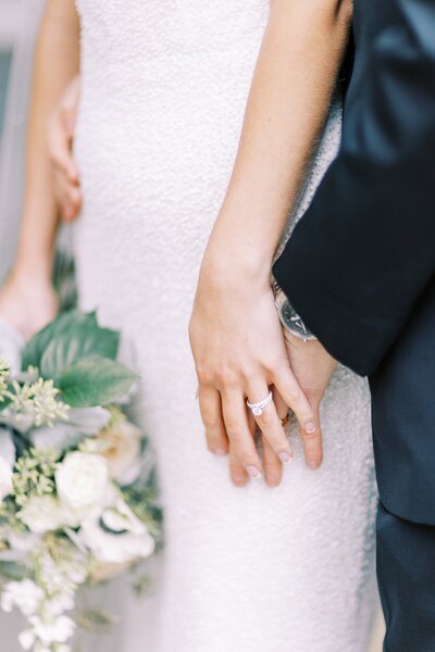 Bride and groom holding hands