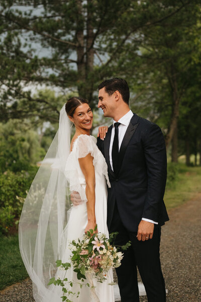couple holding hands in front of ceremony altar