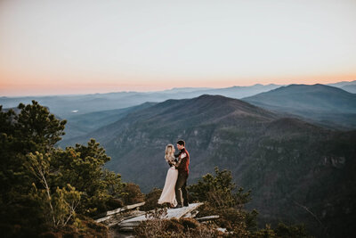 Luxury Wedding Portraits by Moving Mountains Photography in NC - Photo of a bride and groom with a mountainous view.