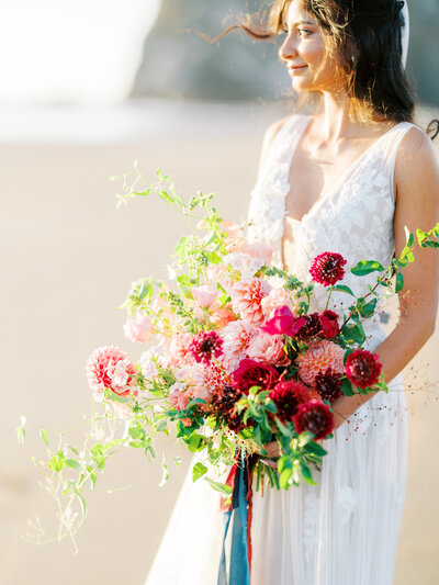 cannon beach bridal portraits with lush dahlia bouquet