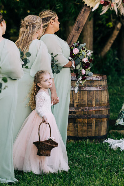 Flower girl with bridesmaids at wedding ceremony