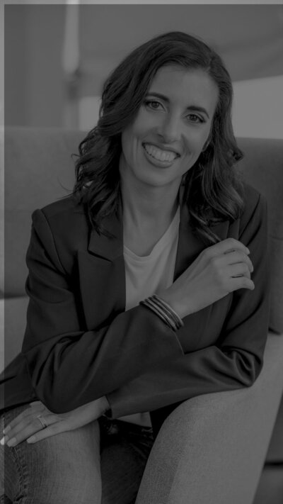 entrepreneur in casual studio setting with natural lighting black and white