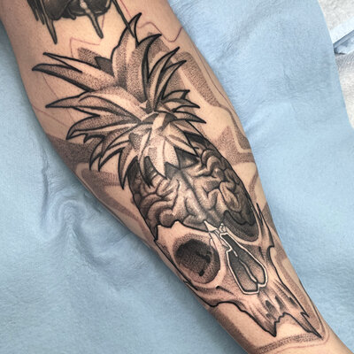 A black and gray tattoo of Betty and florals.