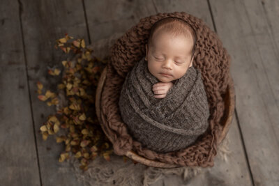 Pittsburgh newborn photographer pictures of boy wrapped in brown