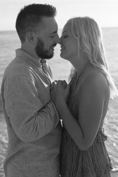 Romantic beach proposal at sunset, captured by Tampa wedding photographer, Priscila Del Cristo.