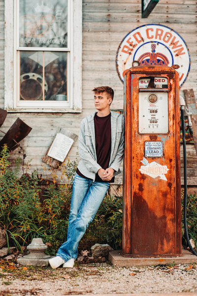 new-diggings-senior-photographer-wisconsin-guy-standing-along-gas-pump