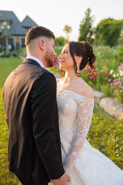 Bride and groom under veil
